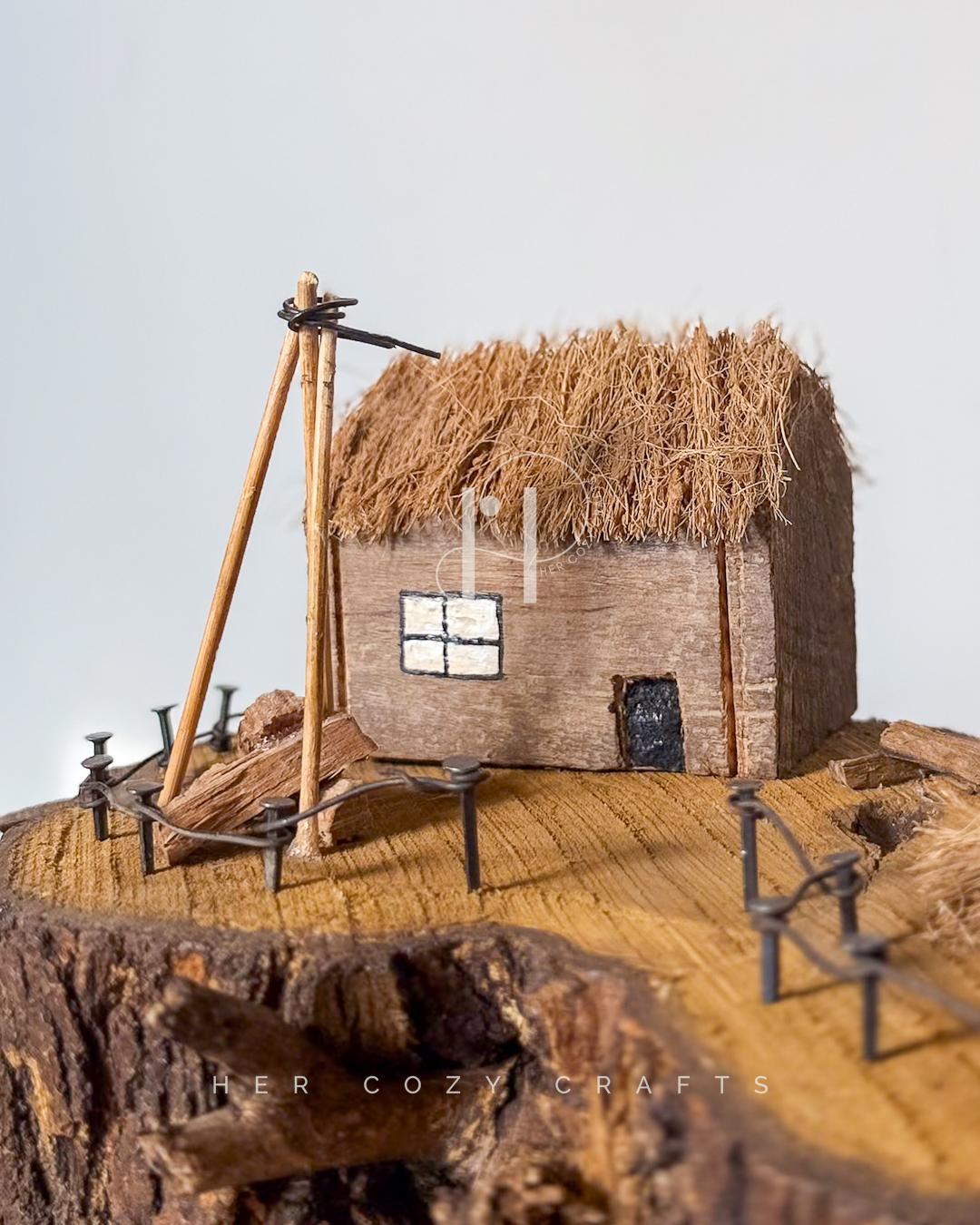 Meadow Rise Lamp - Slim branch frames cottage scene with gentle glow