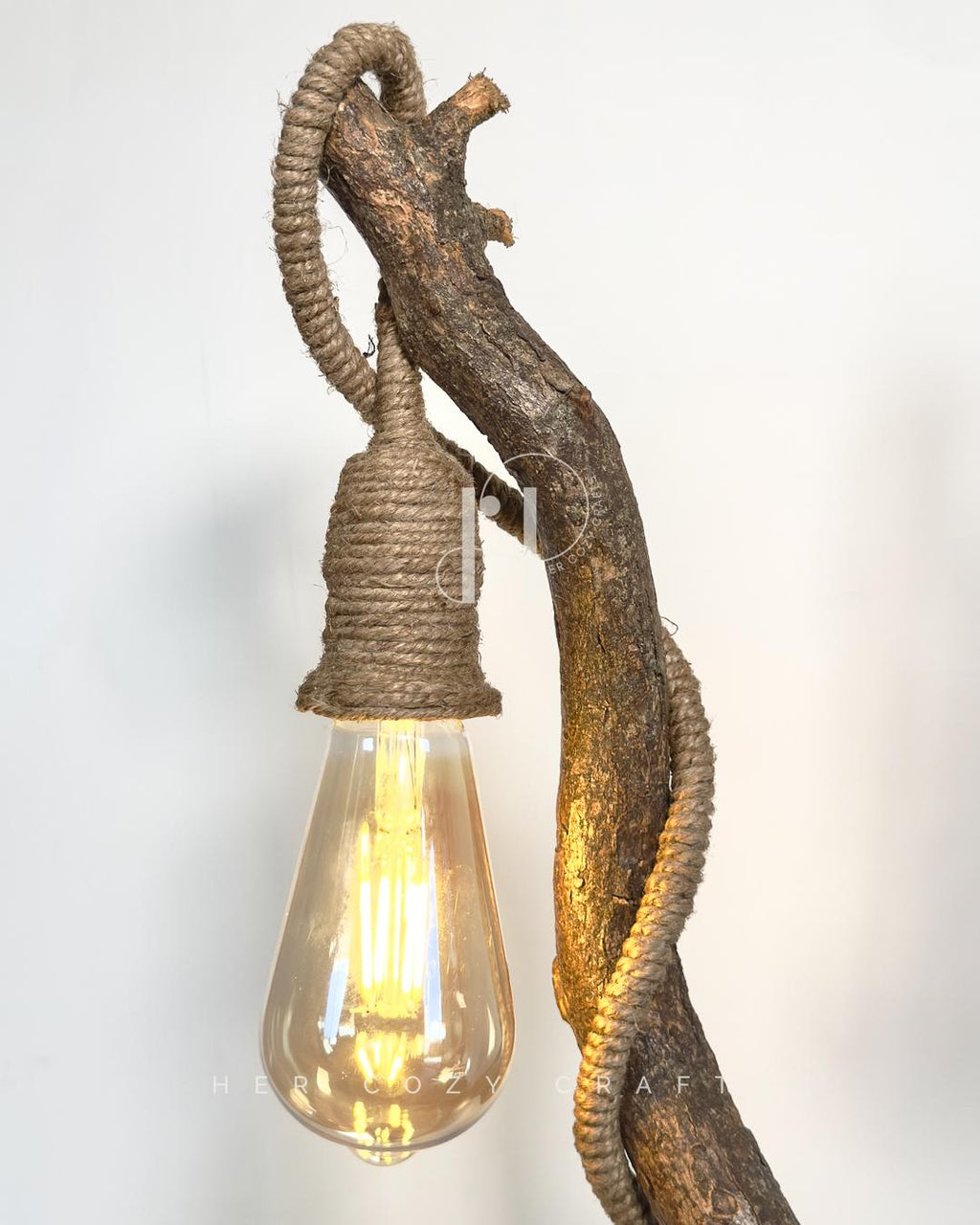 Meadow Rise Lamp - Slim branch frames cottage scene with gentle glow