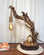 Worklight Signature Lamp - Arched branch with hanging bulb and village base
