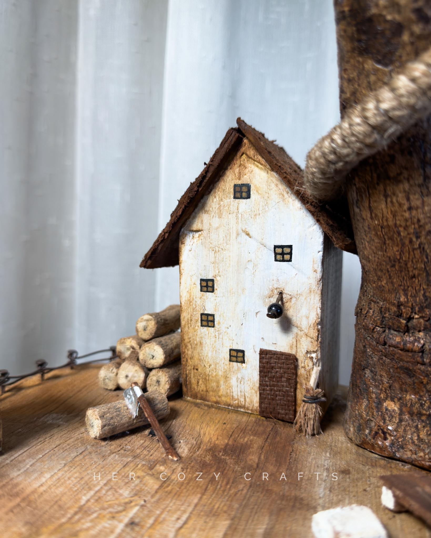 Worklight Signature Lamp - Arched branch with hanging bulb and village base