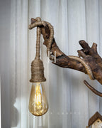 Worklight Signature Lamp - Arched branch with hanging bulb and village base