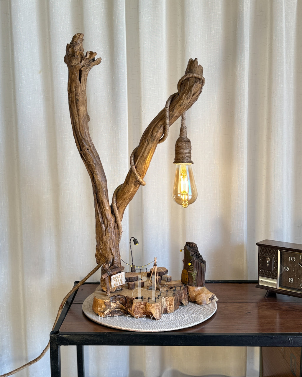Safari Yard Lamp - Tall driftwood branch with hanging bulb and cafe scene