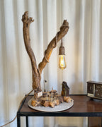 Safari Yard Lamp - Tall driftwood branch with hanging bulb and cafe scene