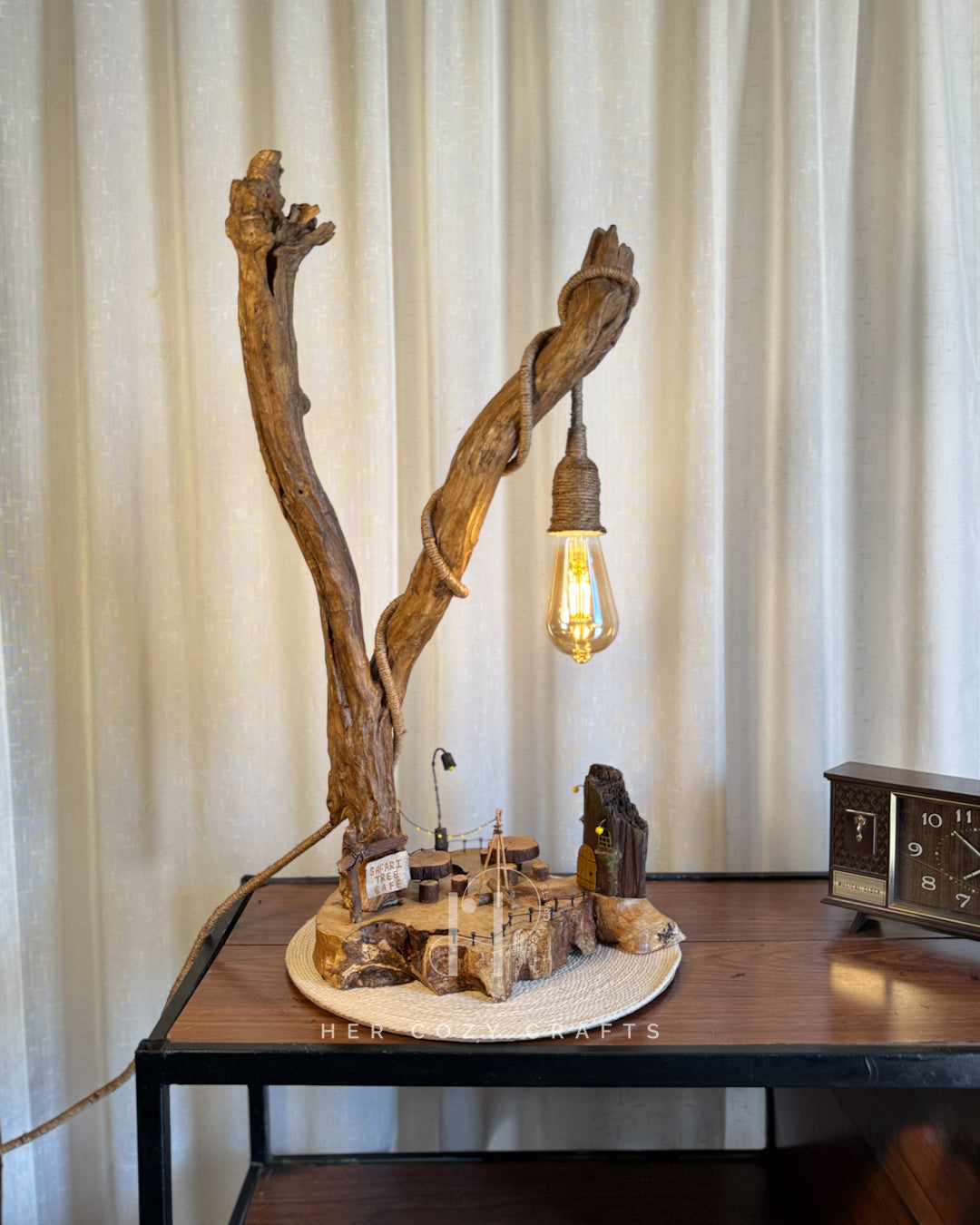 Safari Yard Lamp - Tall driftwood branch with hanging bulb and cafe scene