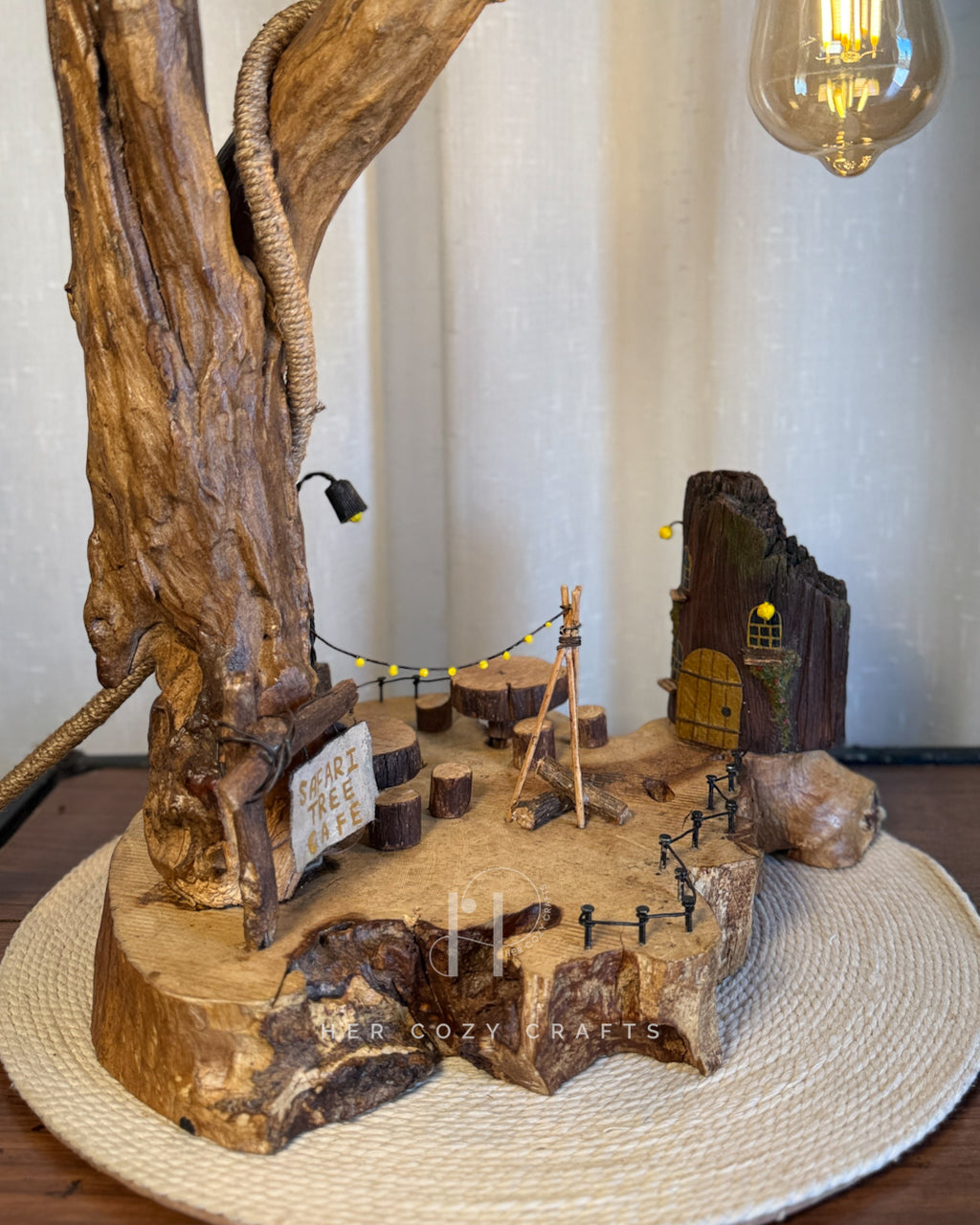 Safari Yard Lamp - Tall driftwood branch with hanging bulb and cafe scene