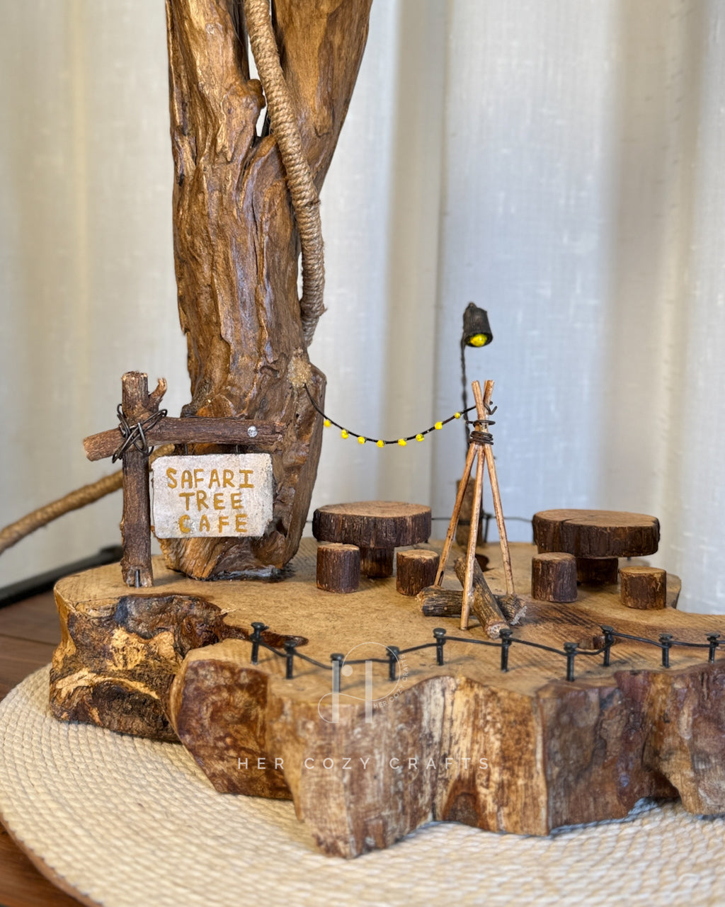 Safari Yard Lamp - Tall driftwood branch with hanging bulb and cafe scene