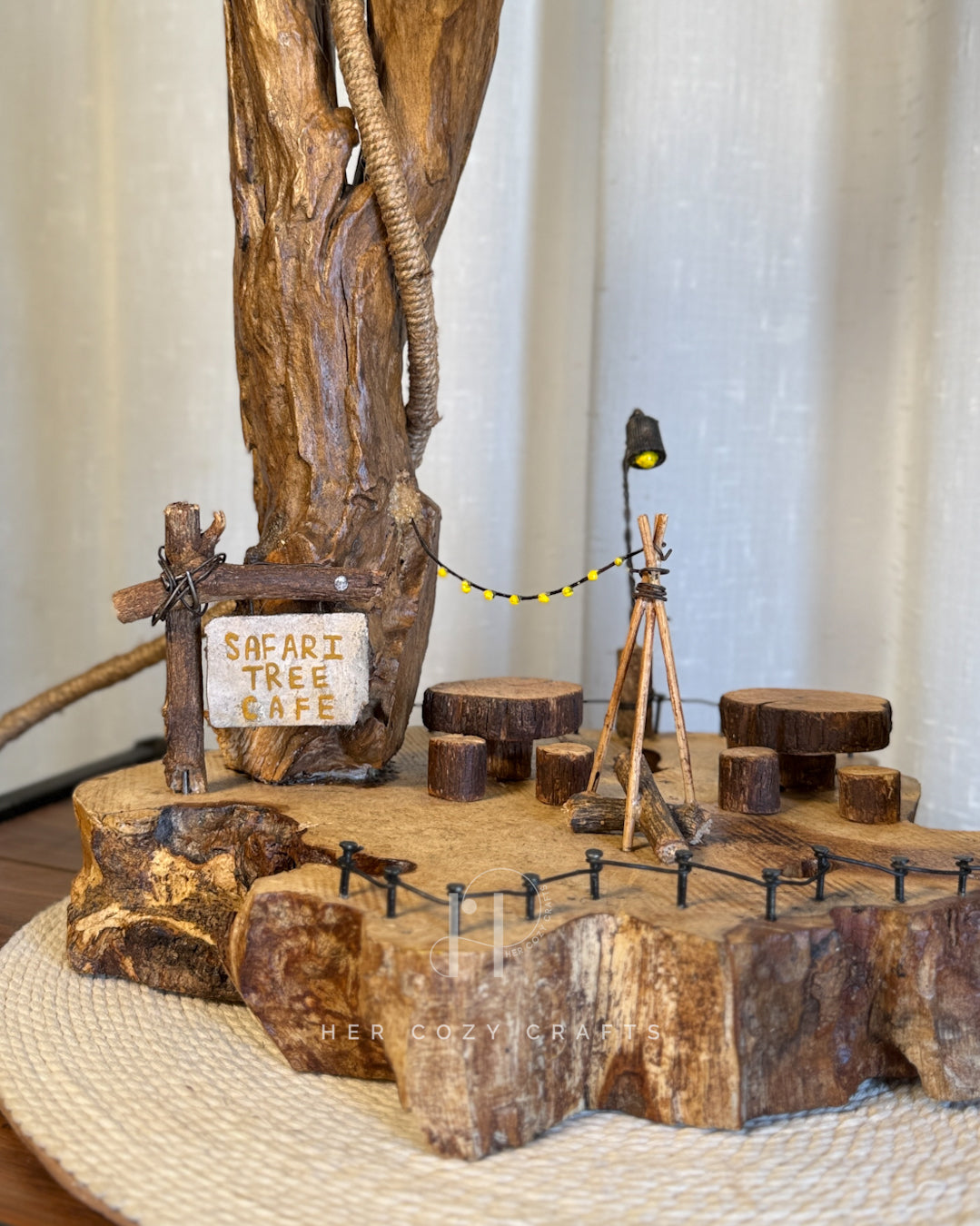 Safari Yard Lamp - Tall driftwood branch with hanging bulb and cafe scene