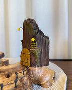 Safari Yard Lamp - Tall driftwood branch with hanging bulb and cafe scene