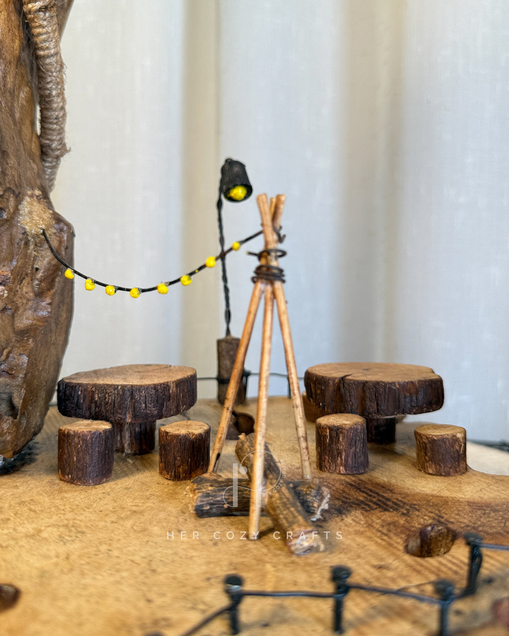 Safari Yard Lamp - Tall driftwood branch with hanging bulb and cafe scene
