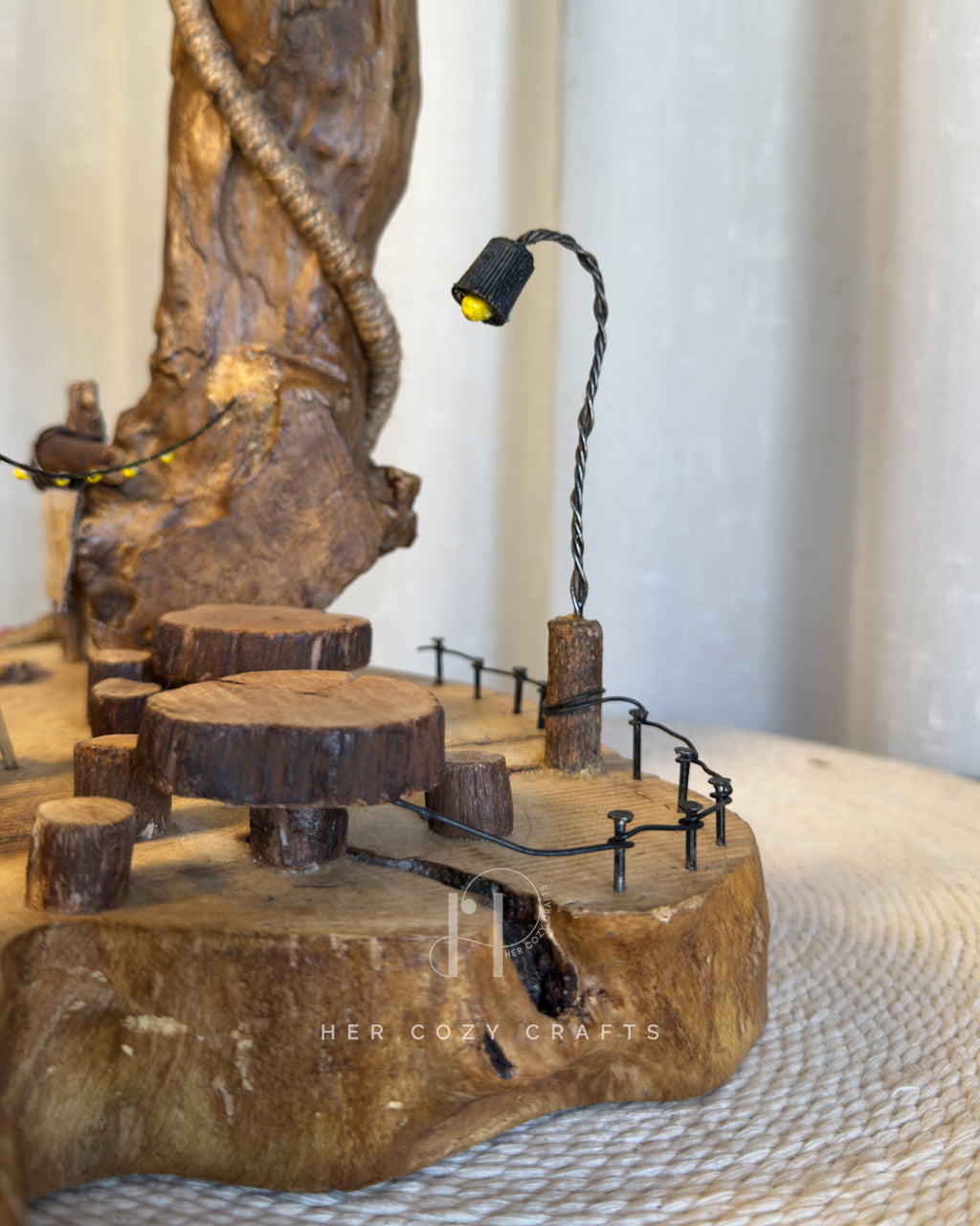 Safari Yard Lamp - Tall driftwood branch with hanging bulb and cafe scene
