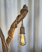 Safari Yard Lamp - Tall driftwood branch with hanging bulb and cafe scene