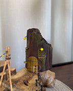 Safari Yard Lamp - Tall driftwood branch with hanging bulb and cafe scene