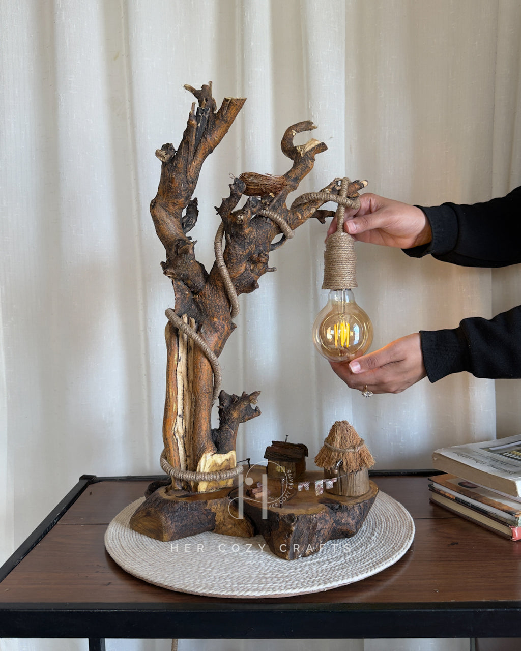 Nestwood Yard Lamp - Tall driftwood stem with hanging bulb and hut scene