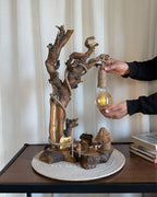 Nestwood Yard Lamp - Tall driftwood stem with hanging bulb and hut scene
