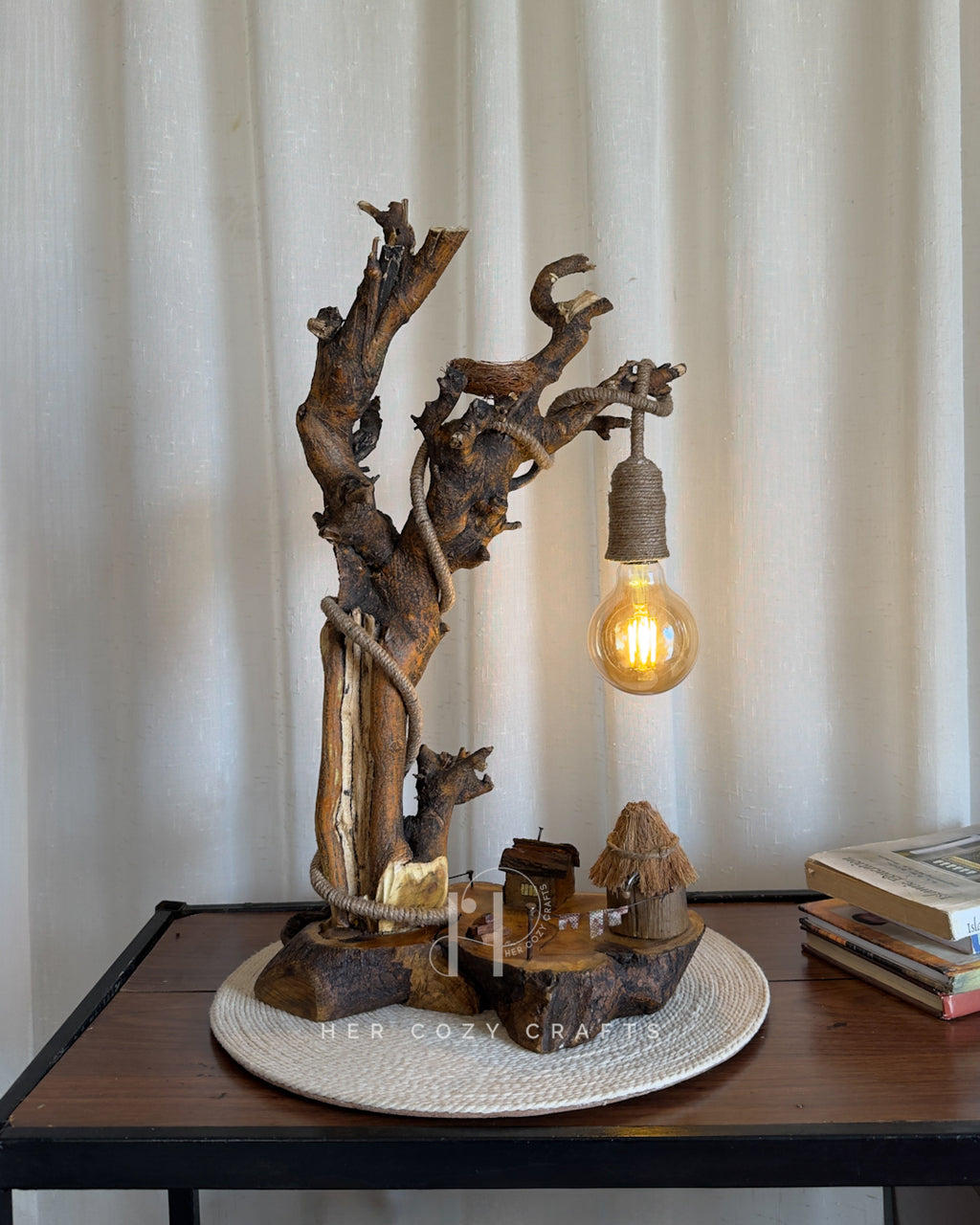 Nestwood Yard Lamp - Tall driftwood stem with hanging bulb and hut scene