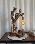 Nestwood Yard Lamp - Tall driftwood stem with hanging bulb and hut scene