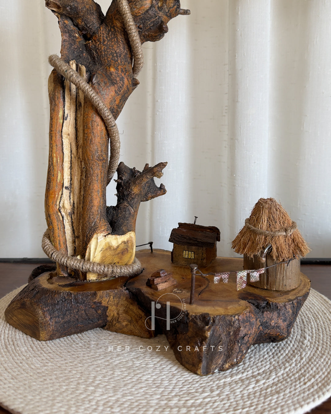 Nestwood Yard Lamp - Tall driftwood stem with hanging bulb and hut scene