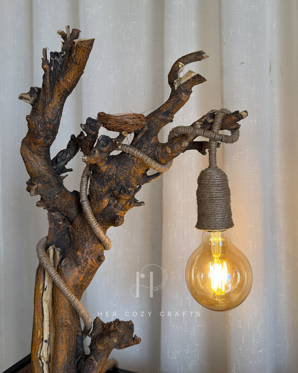 Nestwood Yard Lamp - Tall driftwood stem with hanging bulb and hut scene