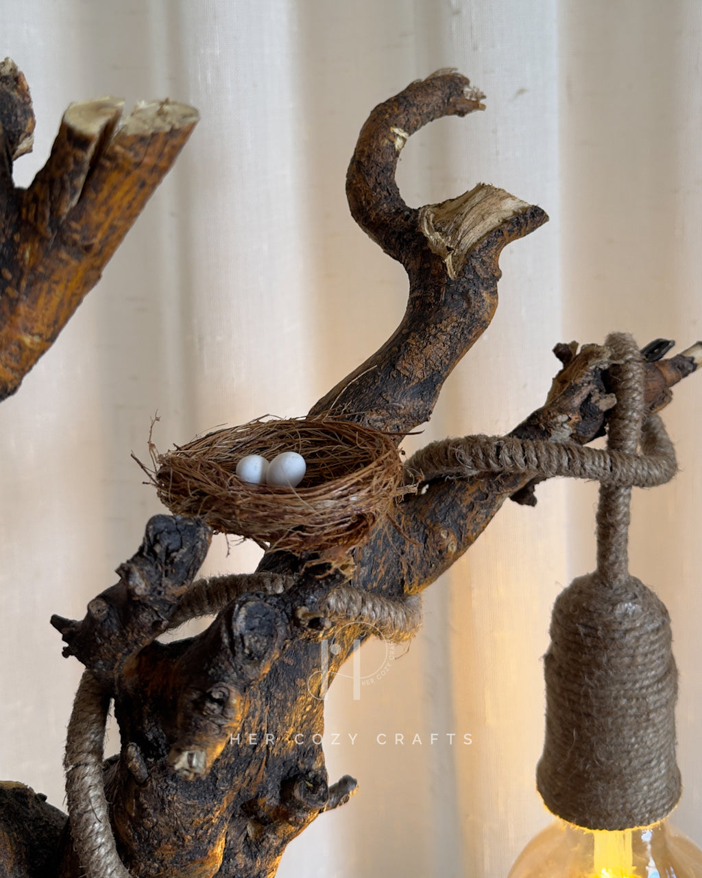 Nestwood Yard Lamp - Tall driftwood stem with hanging bulb and hut scene