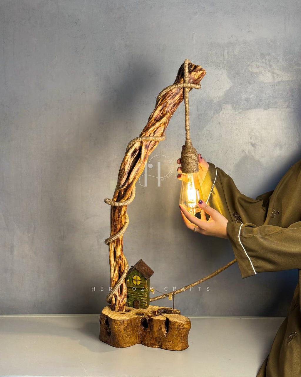 Cottage Climb Lamp - Tall natural wood stem with rope-wrapped hanging bulb and village base