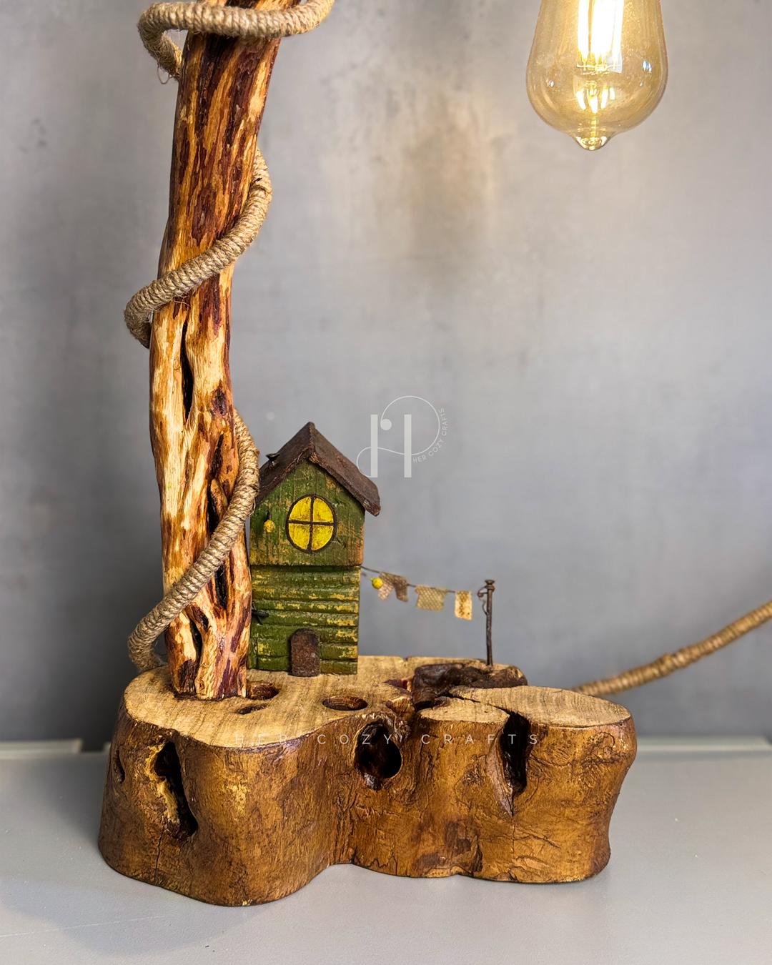 Cottage Climb Lamp - Tall natural wood stem with rope-wrapped hanging bulb and village base