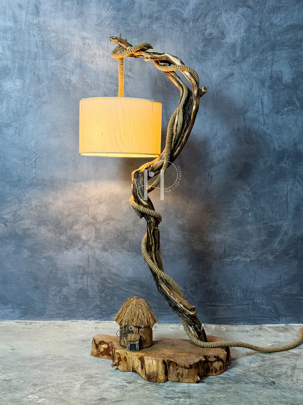 The Wildwood Halo Lamp-
Twisted Driftwood Table Lamp with Jute-Wrapped Branch & Miniature Cottage