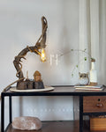 Wildwood Arc Lamp-Natural signature table lamp Base with Rope-Wrapped Hanging Bulb & Miniature Village Detail
