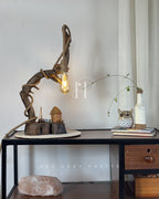 Wildwood Arc Lamp-Natural signature table lamp Base with Rope-Wrapped Hanging Bulb & Miniature Village Detail
