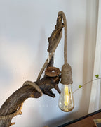 Wildwood Arc Lamp-Natural signature table lamp Base with Rope-Wrapped Hanging Bulb & Miniature Village Detail