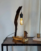 Storywood Lamp - Curved Driftwood Frame with Miniature Cottage Scene & Hanging Edison Bulb

Description: